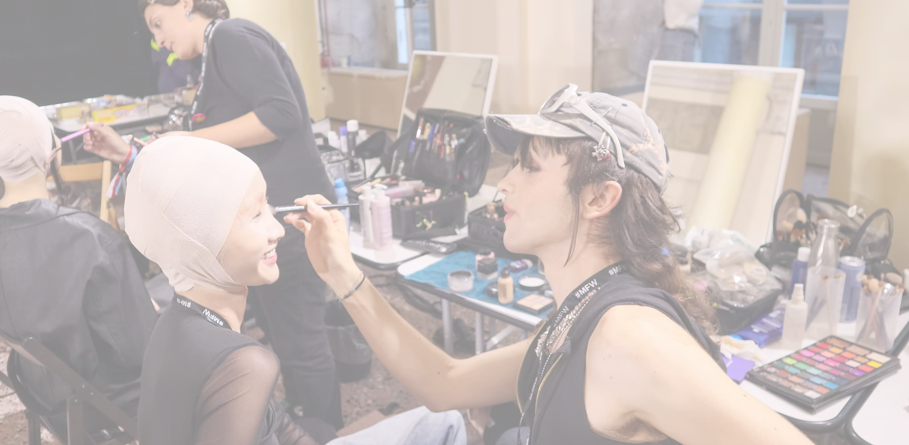 Stefano Laisa applying make-up backstage